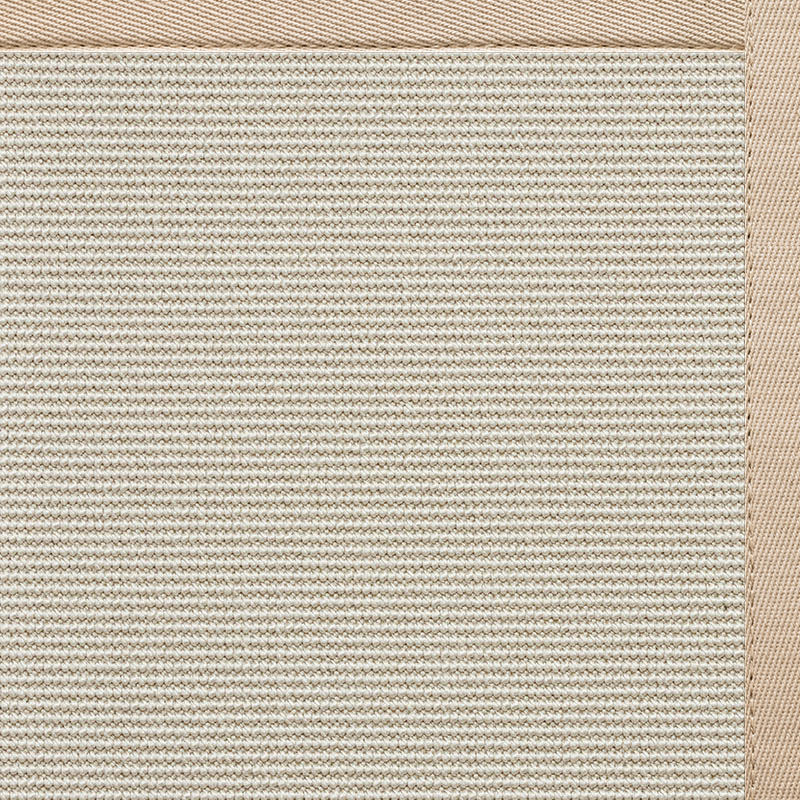 A close-up of a rectangular beige woven rug with a textured surface and a slightly darker beige border along the edges—showcasing one of the best entryway rug material choices for durability and style in high-traffic spaces.