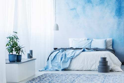 blue white, and gray bedroom 