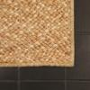 Mahal custom rug on black tile floor, great pairing. Bright colored rug. 