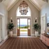Caspian Performance Luxury Rug in Tobacco Entryway with open door and wood accents