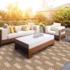 Kalea Performance Luxury Outdoor Rug color Driftwood in outdoor setting with white furniture.