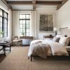 Duvall Wool Leather rug Cognac color in bedroom with white bed natural wood