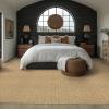 Everly Wool color Fawn in a bedroom.  White bed with accent wall