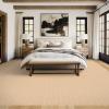 Isabela Wool Nylon Blend Soft sisal like weave in color Cashmere, under a bed in a bedroom soft
