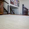 White hemp rug custom on a landing in a home. Soft and warm feeling rug.