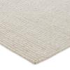 Close-up view of a light beige, textured woven rug with a subtle stripe pattern, shown at an angle on a white background—perfect for enhancing your outdoor isla retreat.