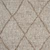 Close-up of a textured beige fabric with a herringbone pattern, displaying V-shaped woven lines reminiscent of classic area rug patterns running diagonally across the surface.