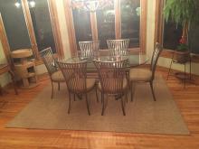 A Rectangle Sisal Rug Defines an Eating Area
