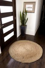 Tan Round Jute Rug in an Entryway